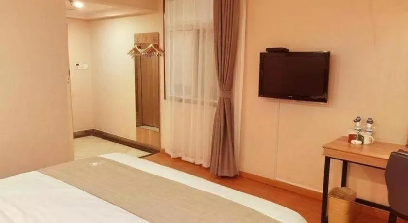 Bed in GreenTree Inn Kunshan Shimao Plaza Business Hotel