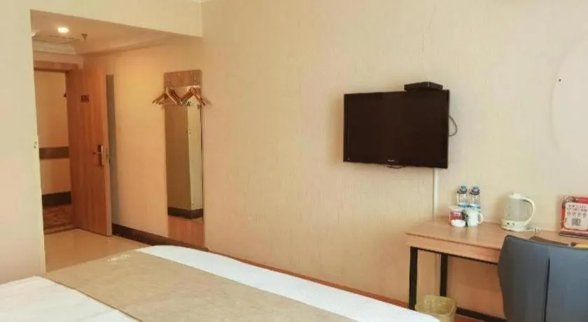 Bed in GreenTree Inn Kunshan Shimao Plaza Business Hotel