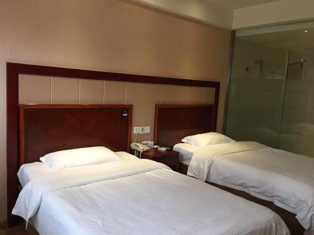 Bed in GreenTree Inn Kunshan Shimao Plaza Business Hotel
