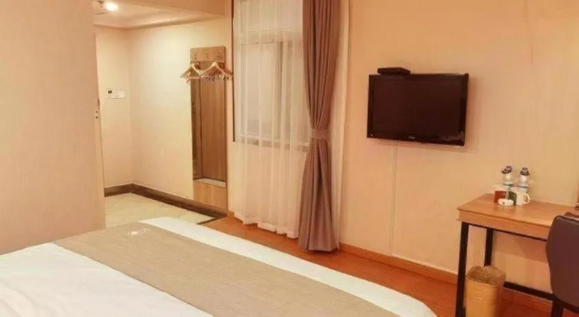 Bed in GreenTree Inn Kunshan Shimao Plaza Business Hotel
