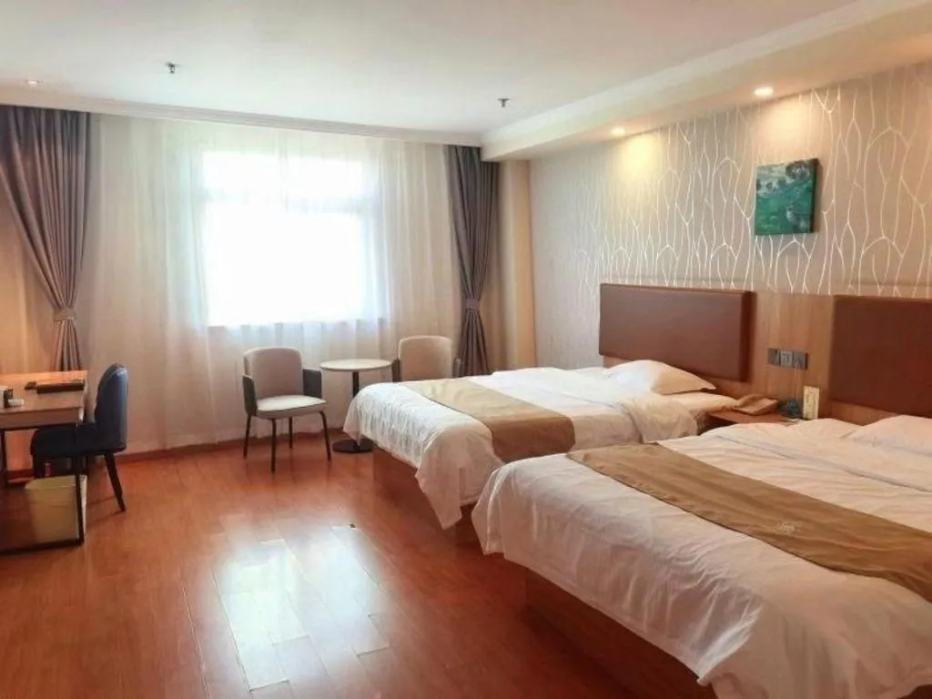 Bed in GreenTree Inn Kunshan Shimao Plaza Business Hotel