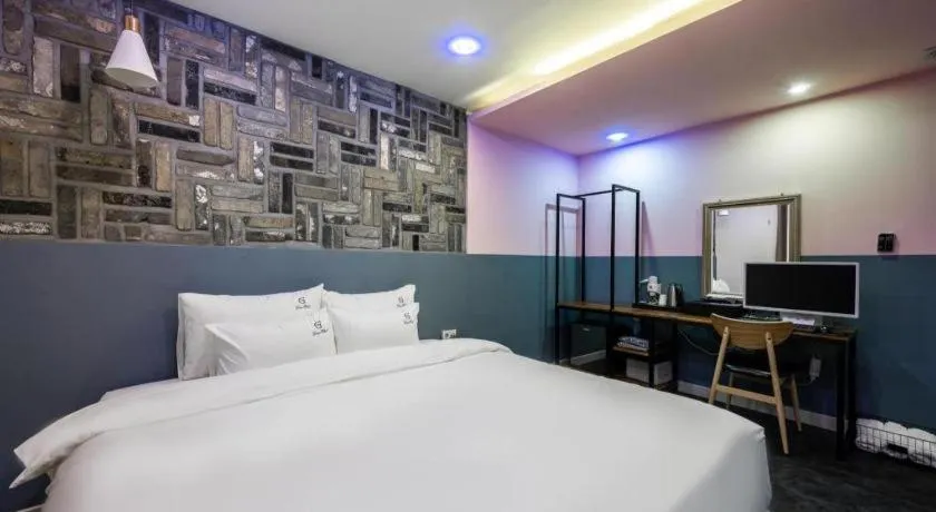 Bed in Gray Hotel