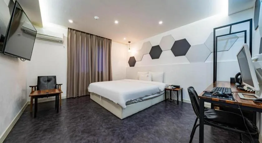 Bed in Gray Hotel