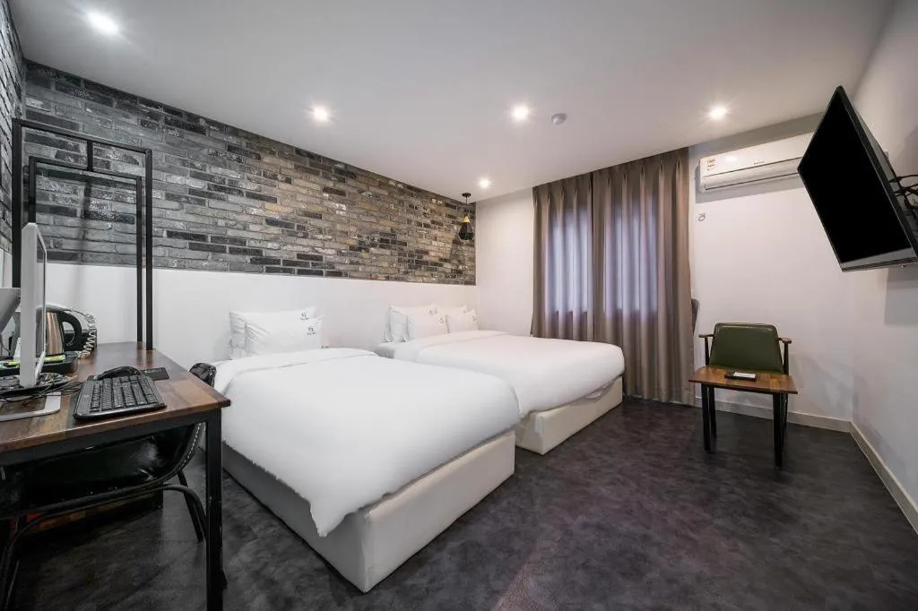Bed in Gray Hotel