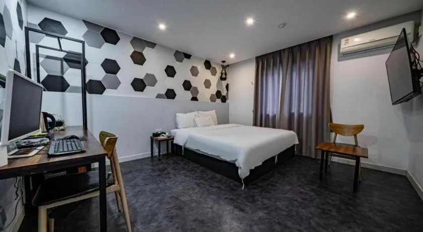 Bed in Gray Hotel