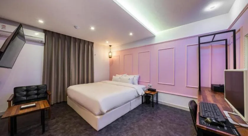 Bed in Gray Hotel