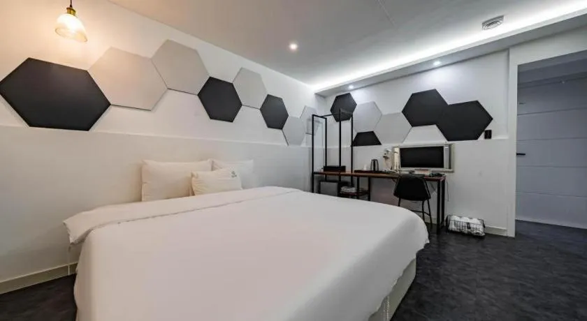 Bed in Gray Hotel