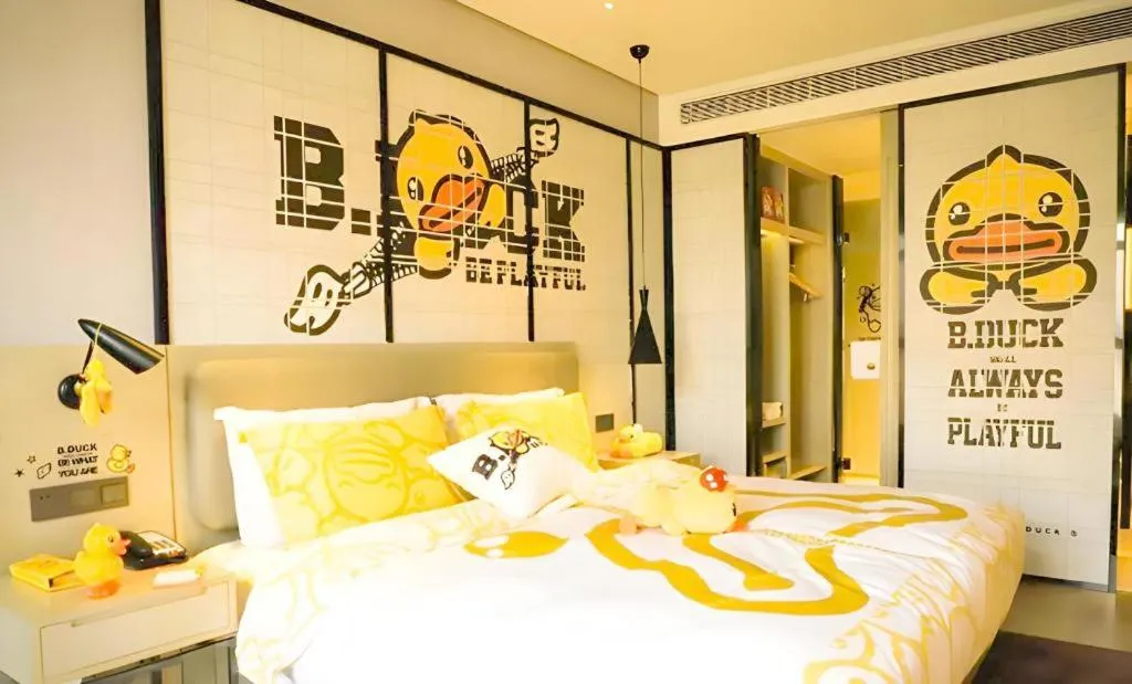 Bed in Echarm Hotel Qionghai Wanquan River