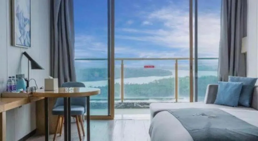 Bed in Echarm Hotel Qionghai Wanquan River