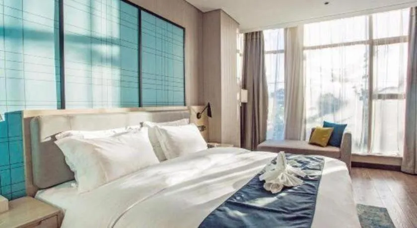 Bed in Echarm Hotel Qionghai Wanquan River