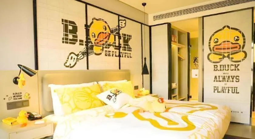 Bed in Echarm Hotel Qionghai Wanquan River