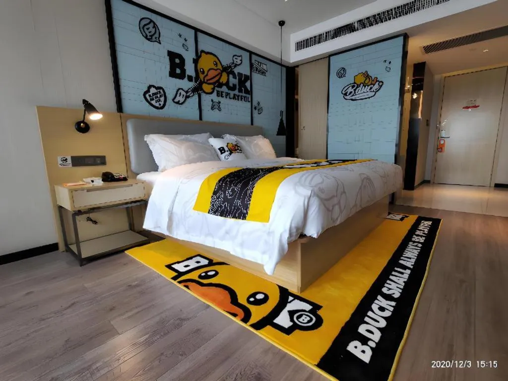 Bed in Echarm Hotel Qionghai Wanquan River