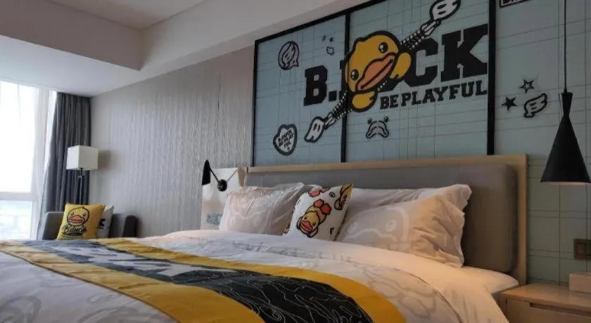 Bed in Echarm Hotel Qionghai Wanquan River