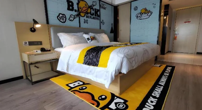 Bed in Echarm Hotel Qionghai Wanquan River