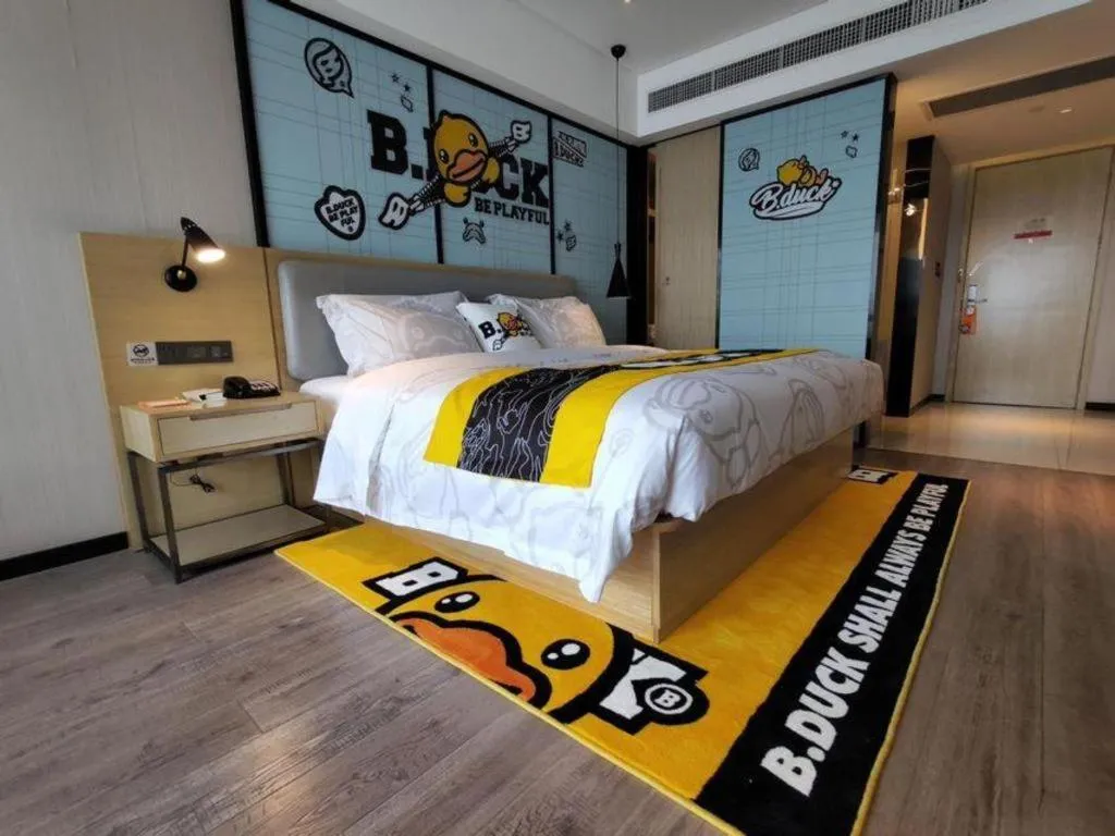 Bed in Echarm Hotel Qionghai Wanquan River