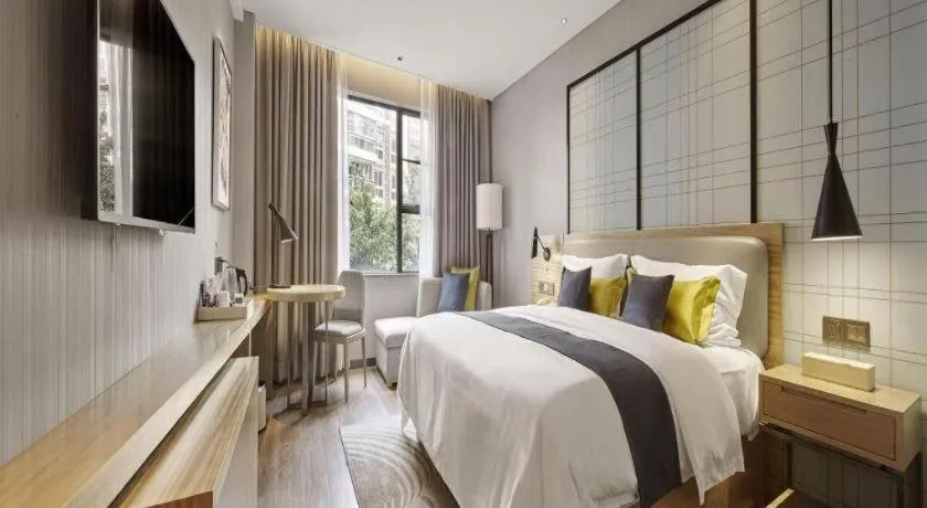 Bed in Echarm Hotel Qionghai Wanquan River