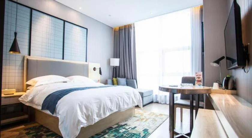 Bed in Echarm Hotel Qionghai Wanquan River