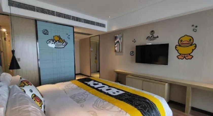 Bed in Echarm Hotel Qionghai Wanquan River