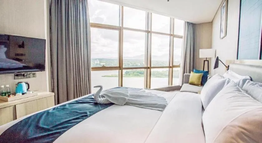 Bed in Echarm Hotel Qionghai Wanquan River