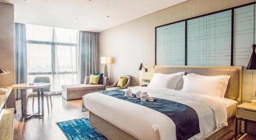 Bed in Echarm Hotel Qionghai Wanquan River