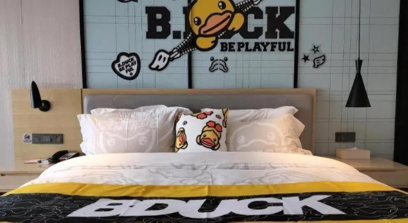 Bed in Echarm Hotel Qionghai Wanquan River