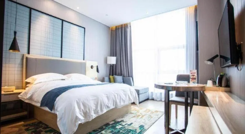 Bed in Echarm Hotel Qionghai Wanquan River