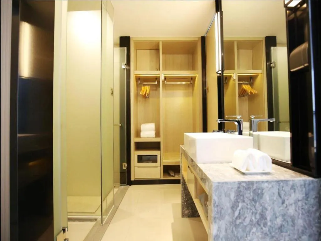 Bed in Echarm Hotel Qionghai Wanquan River