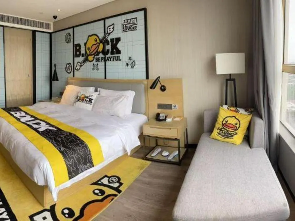 Bed in Echarm Hotel Qionghai Wanquan River