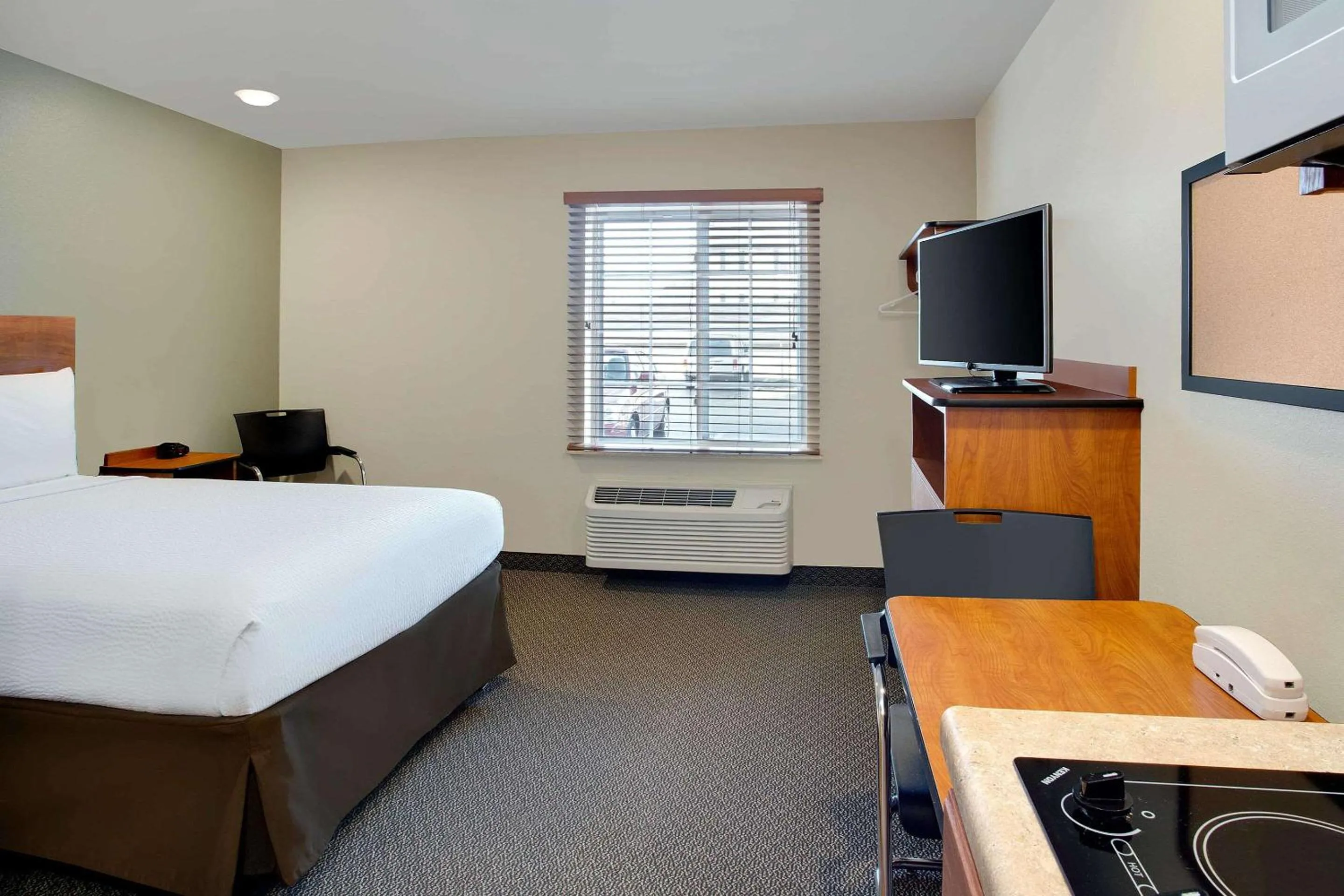 Photo of the whole room, Bed in WoodSpring Suites Columbus North I-270
