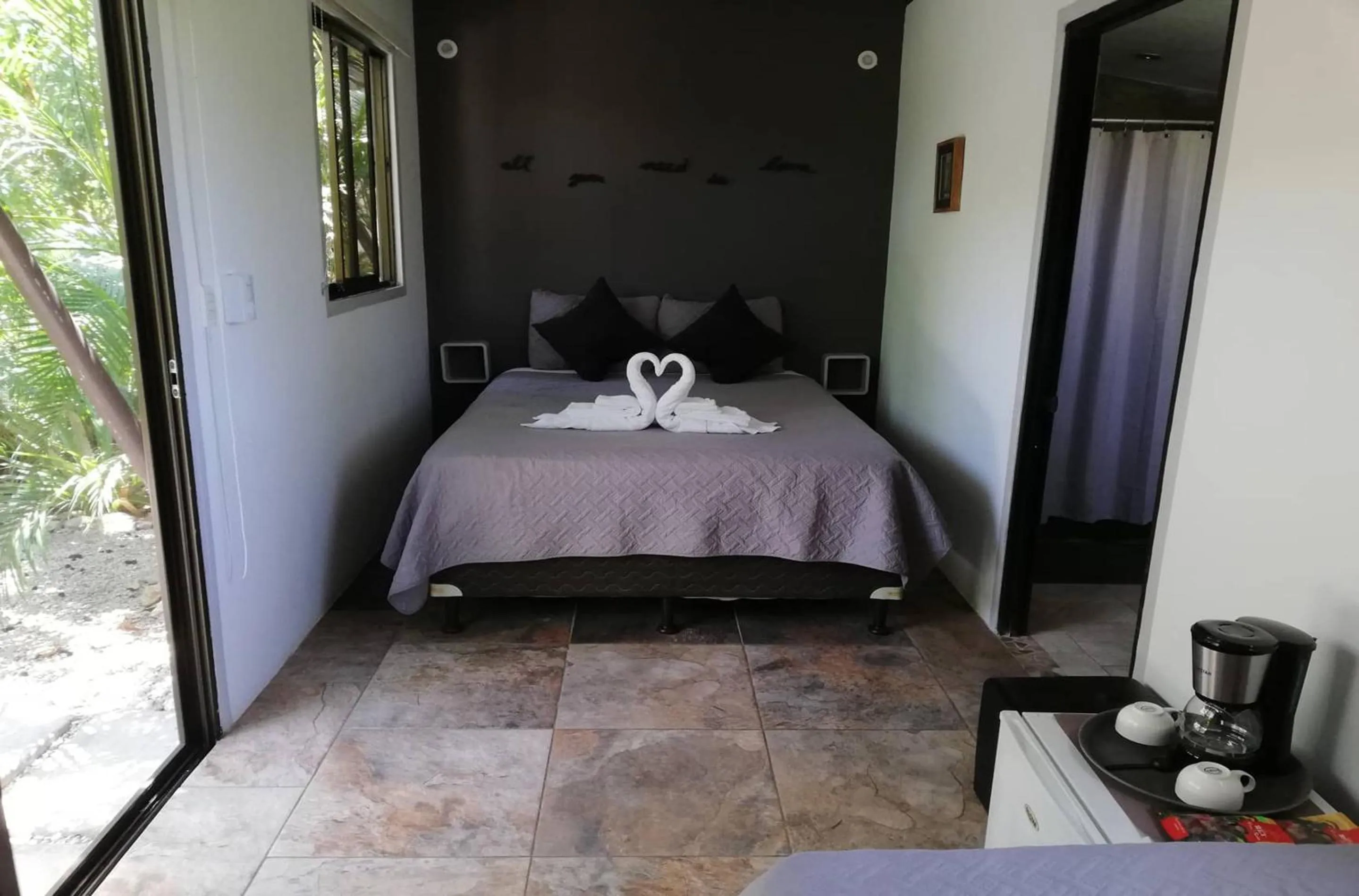 Coffee/tea facilities, Bed in Green Sanctuary Hotel