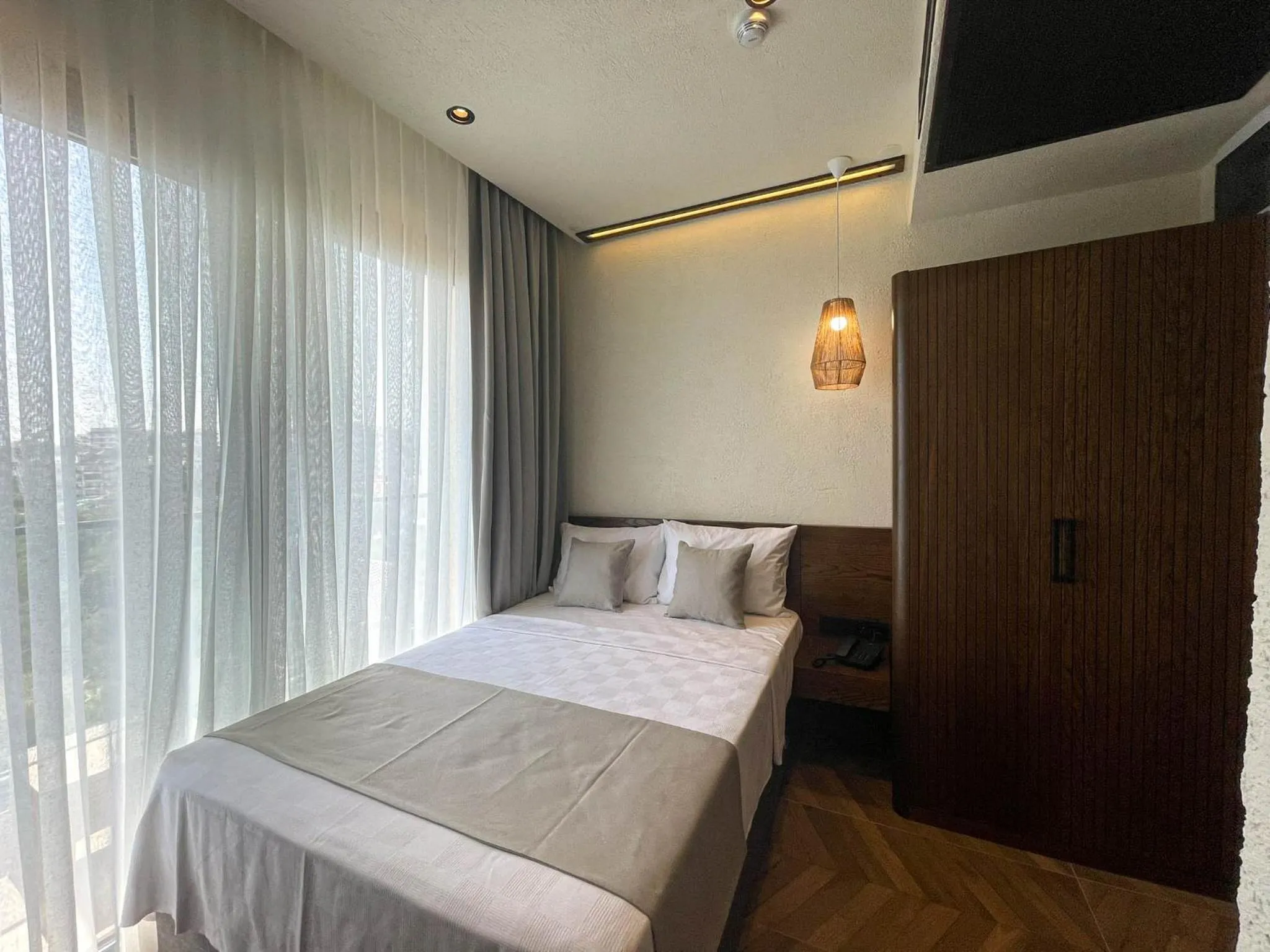 Bed in Now Boutique Hotel