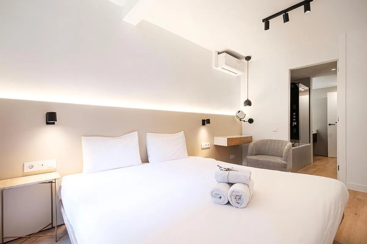 Bed in Happy Apartments