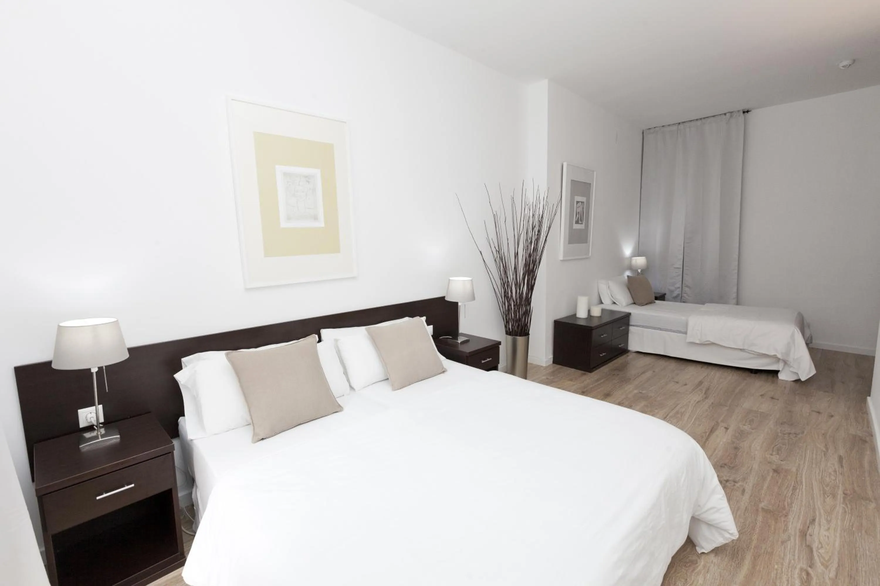 Bed in Happy Apartments