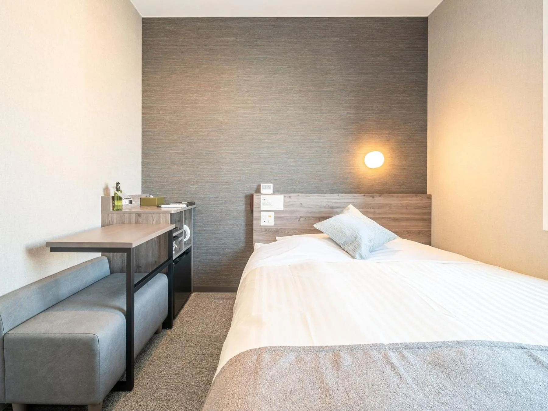 Bed in Super Hotel Premier Nagoya Sakuradoriguchi