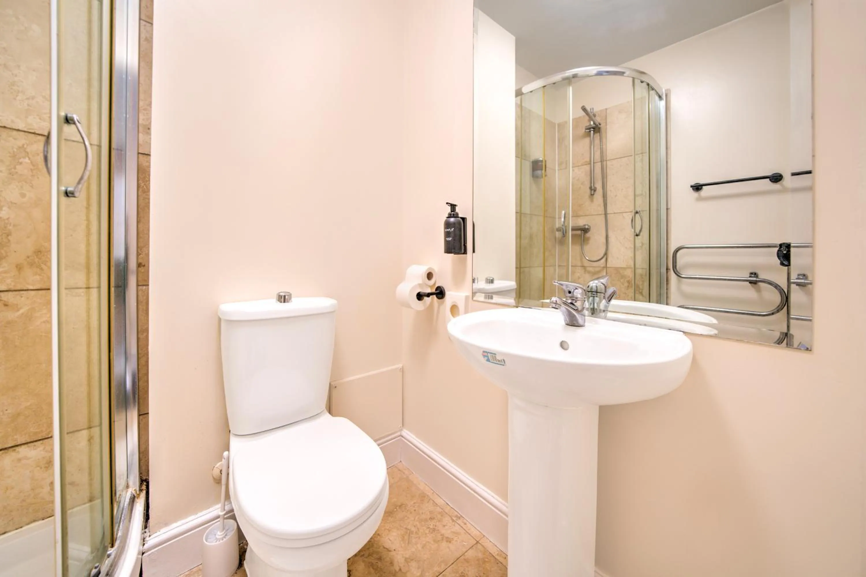 Bathroom in GO2 Gloucester Hotel by OYO