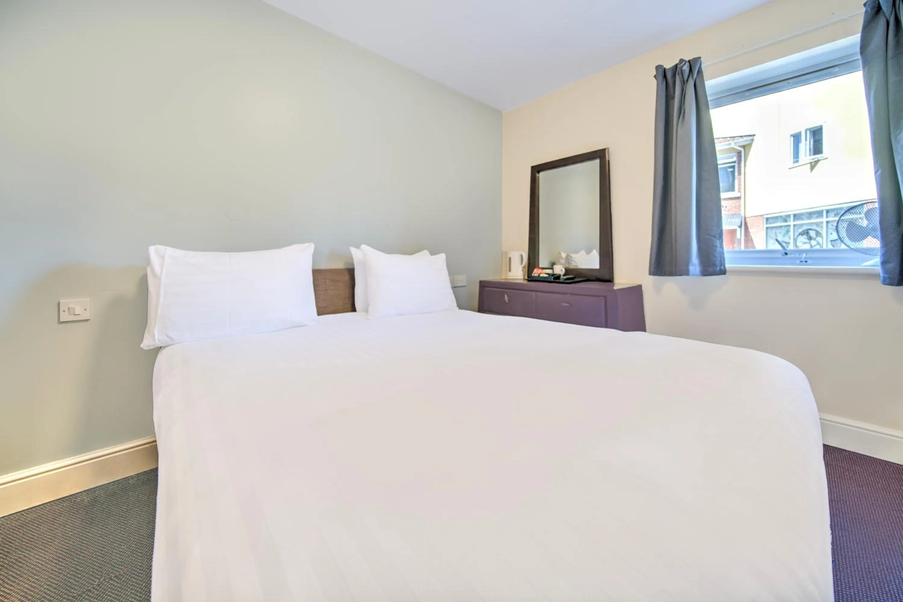 Bedroom, Bed in GO2 Gloucester Hotel by OYO