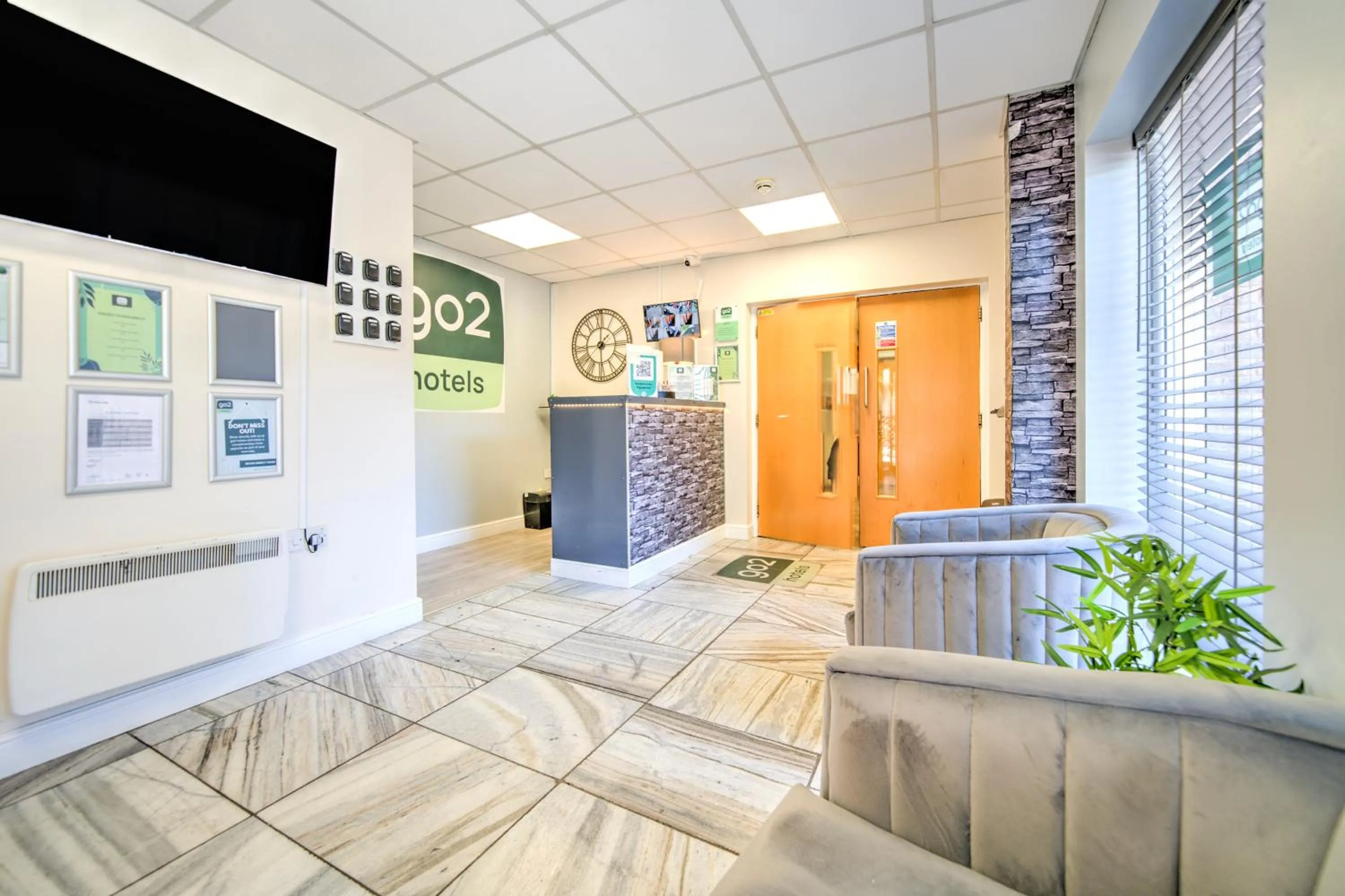 Lobby or reception in GO2 Gloucester Hotel by OYO