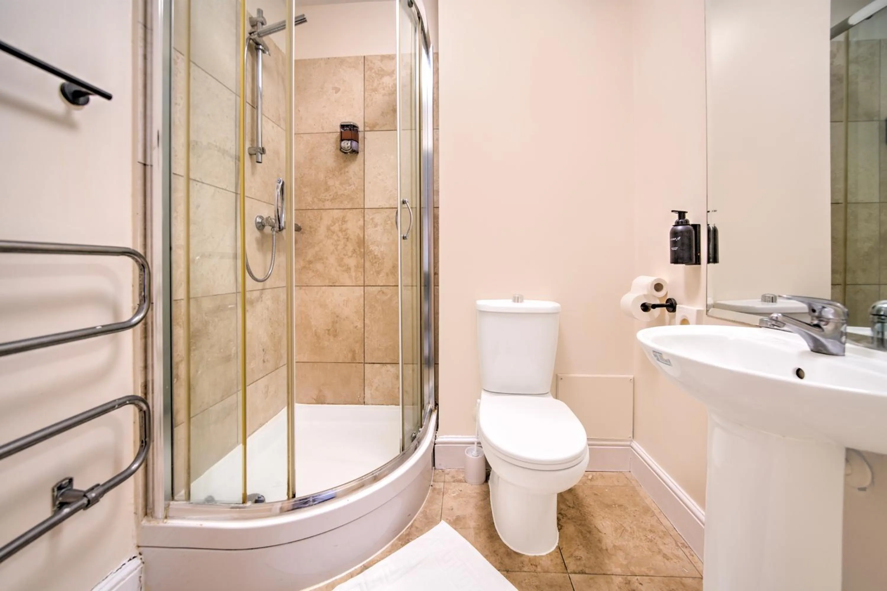 Bathroom in GO2 Gloucester Hotel by OYO