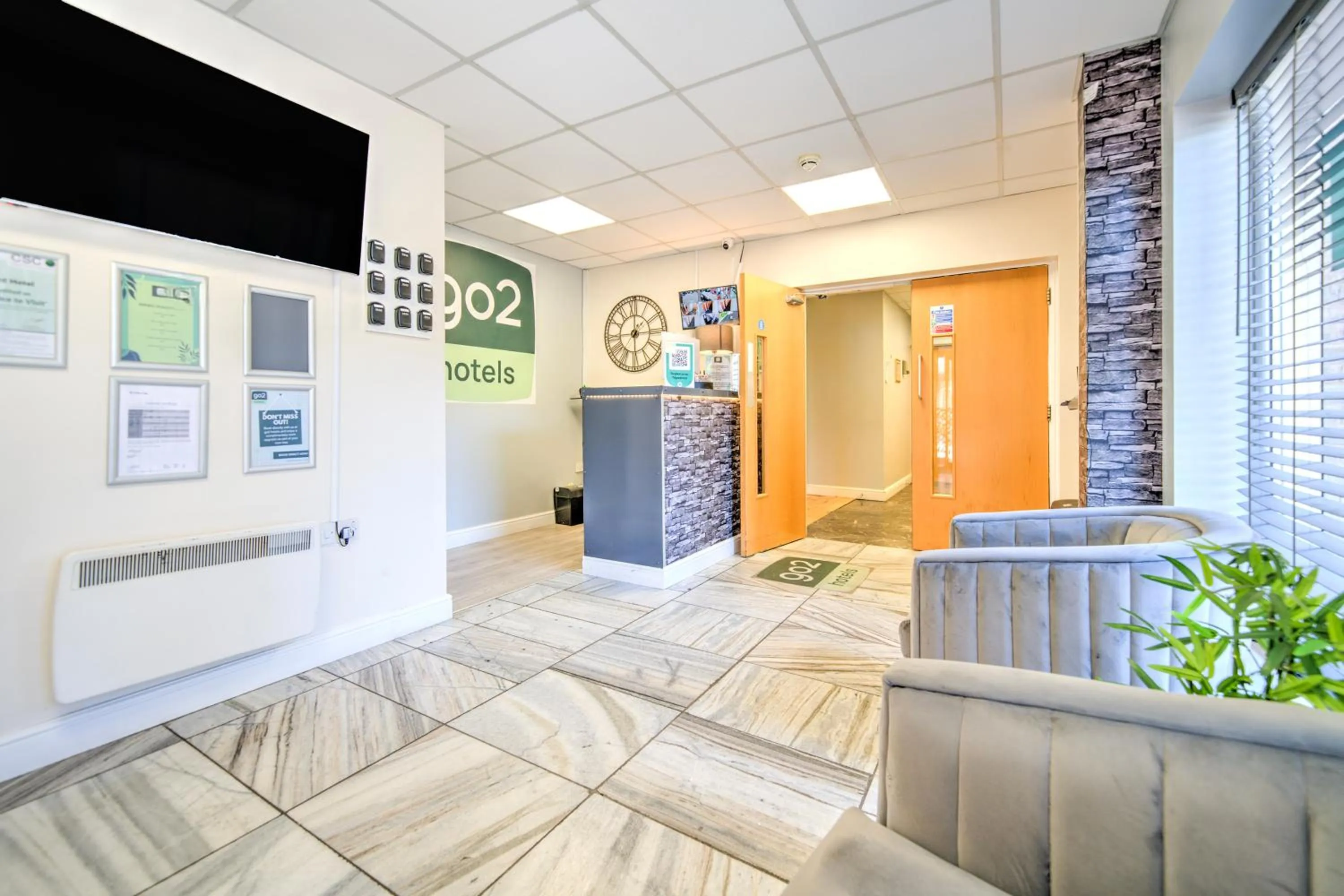 Lobby or reception in GO2 Gloucester Hotel by OYO