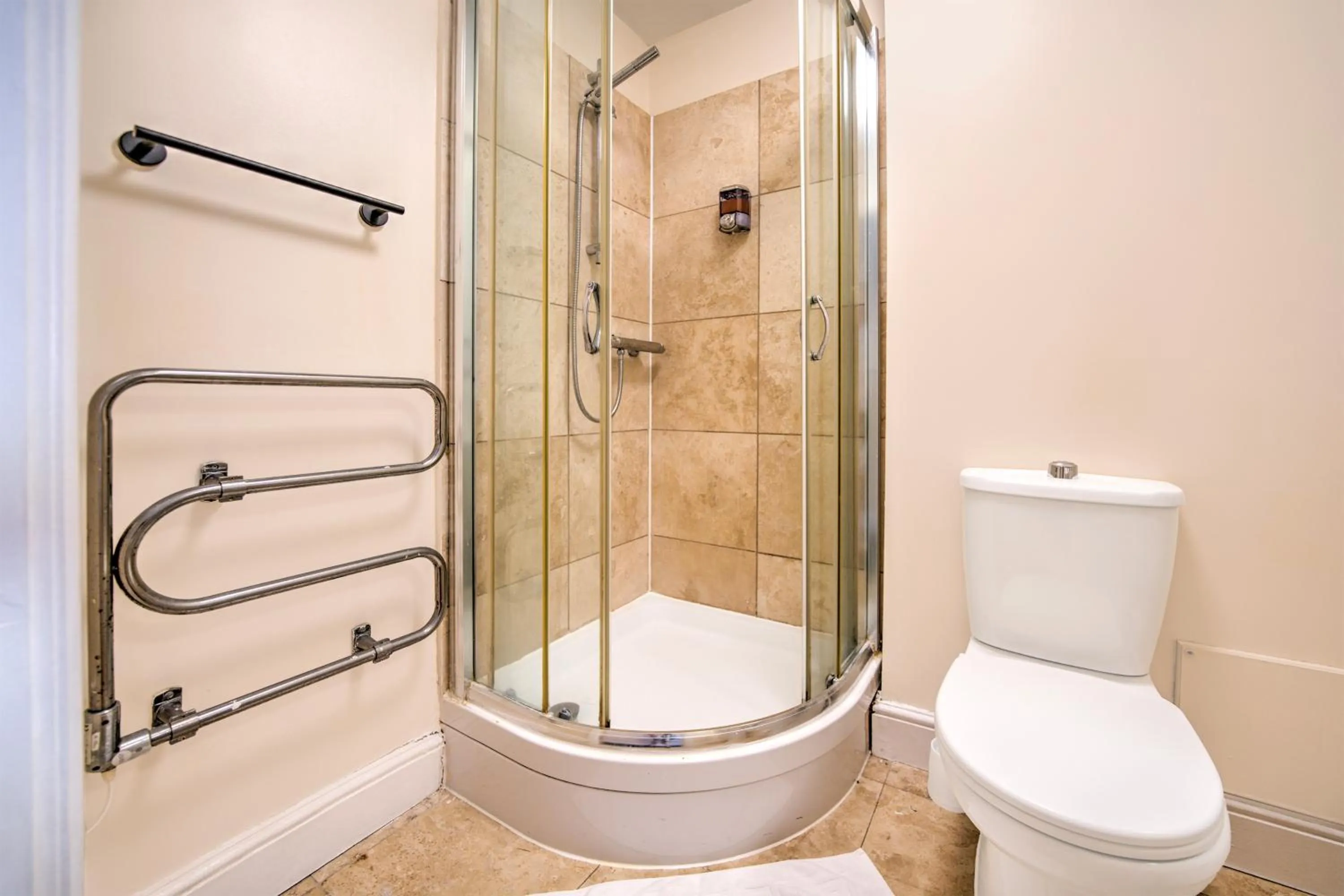 Bathroom in GO2 Gloucester Hotel by OYO