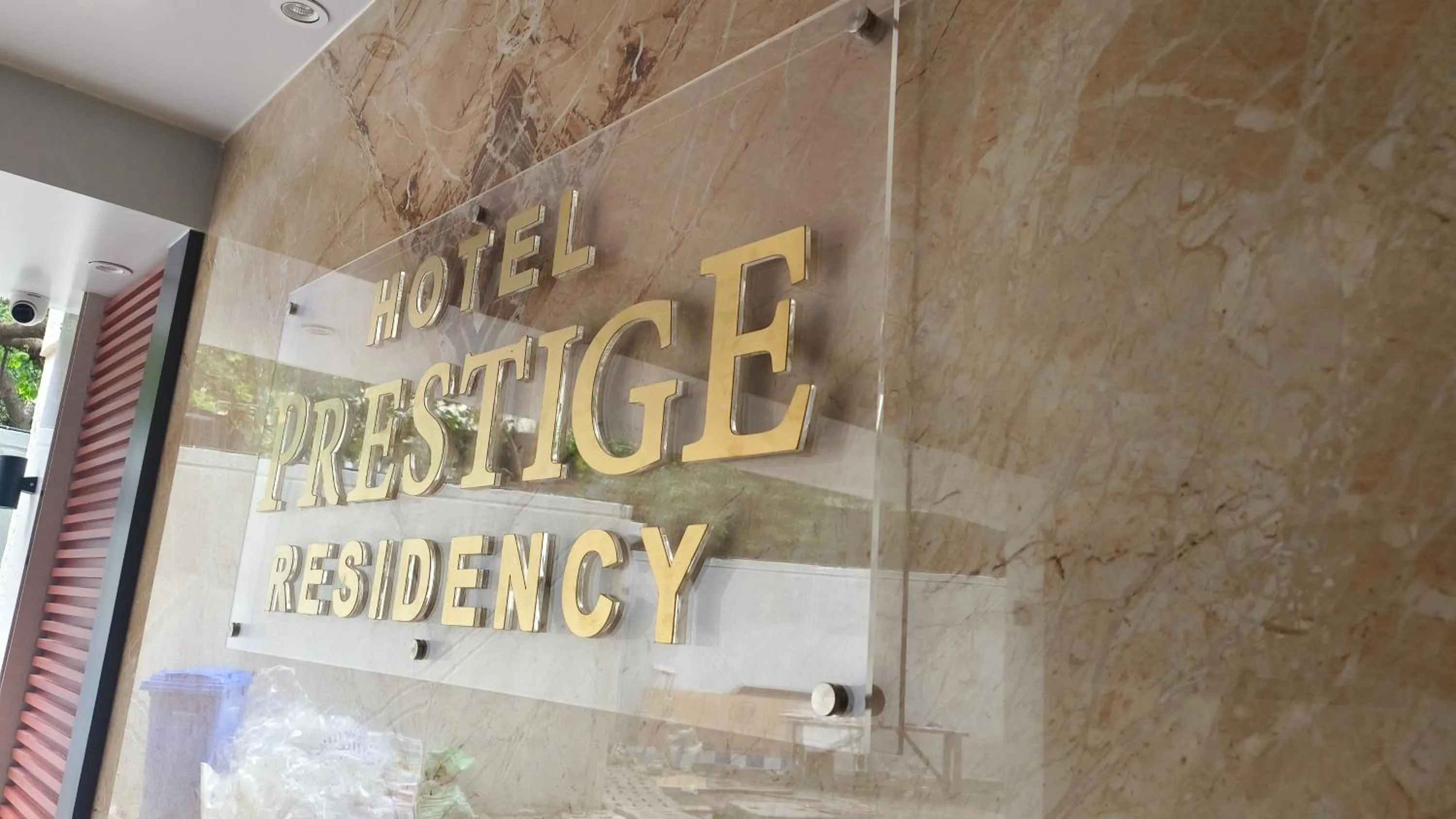 Property logo or sign in Hotel Prestige Residency