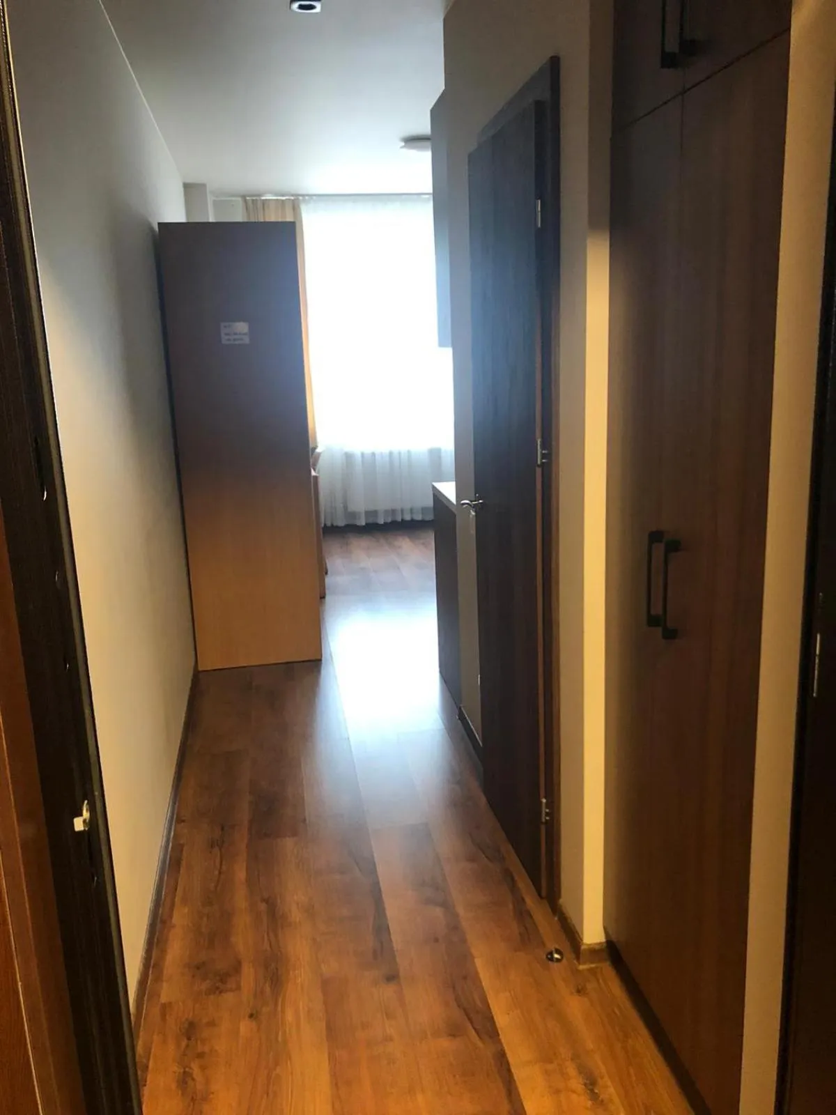 wardrobe in RVR Smart Apartments Riga with Free Parking and Self Check-in