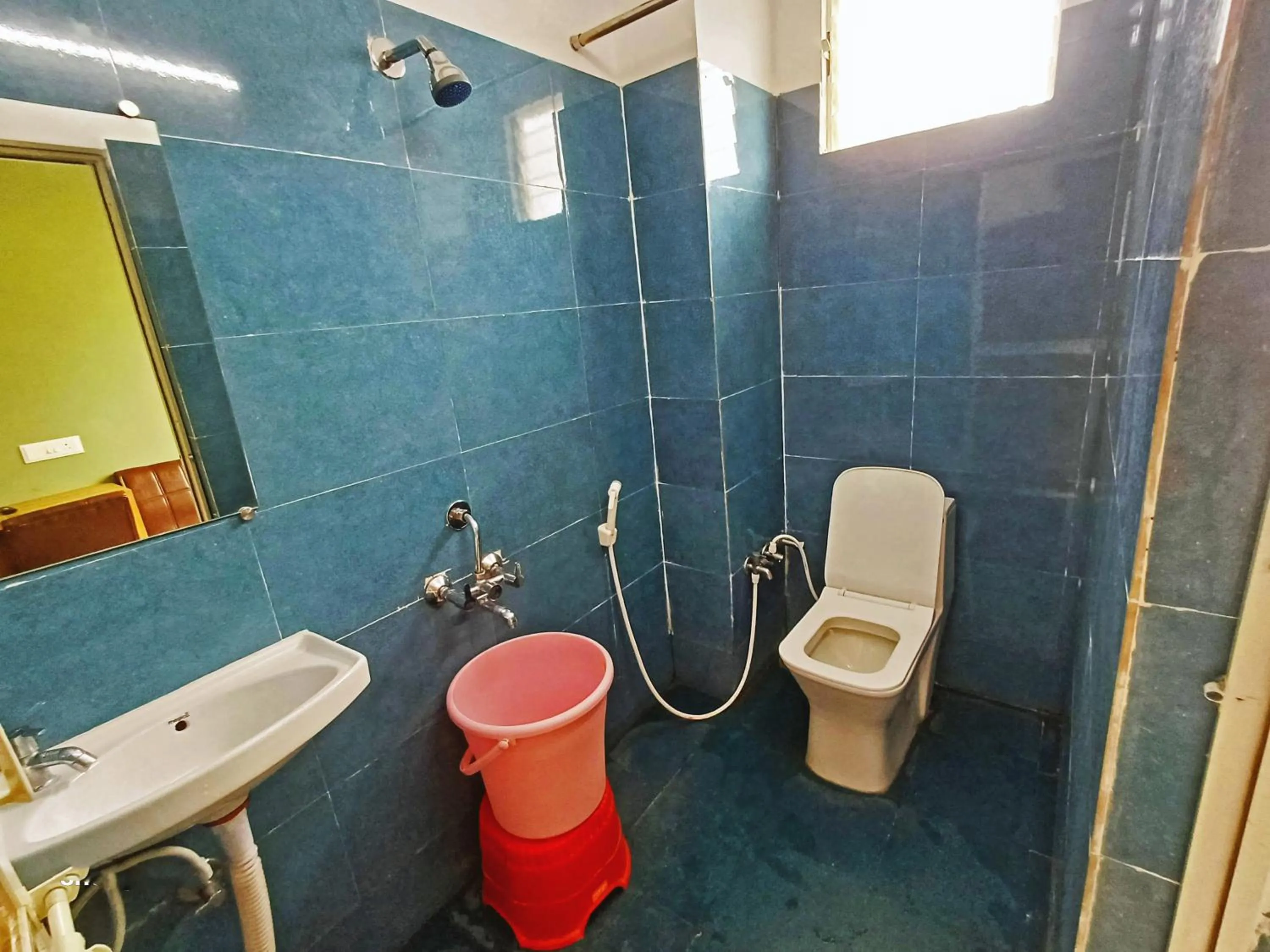 Bathroom in Udupi Deluxe Lodge Gulbarga