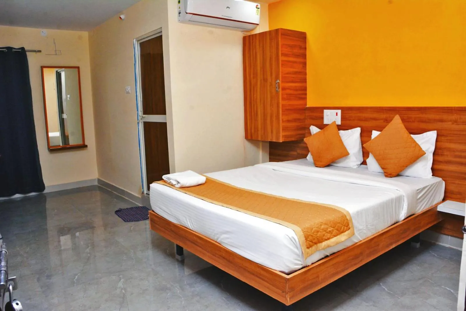 Bedroom in Udupi Deluxe Lodge Gulbarga