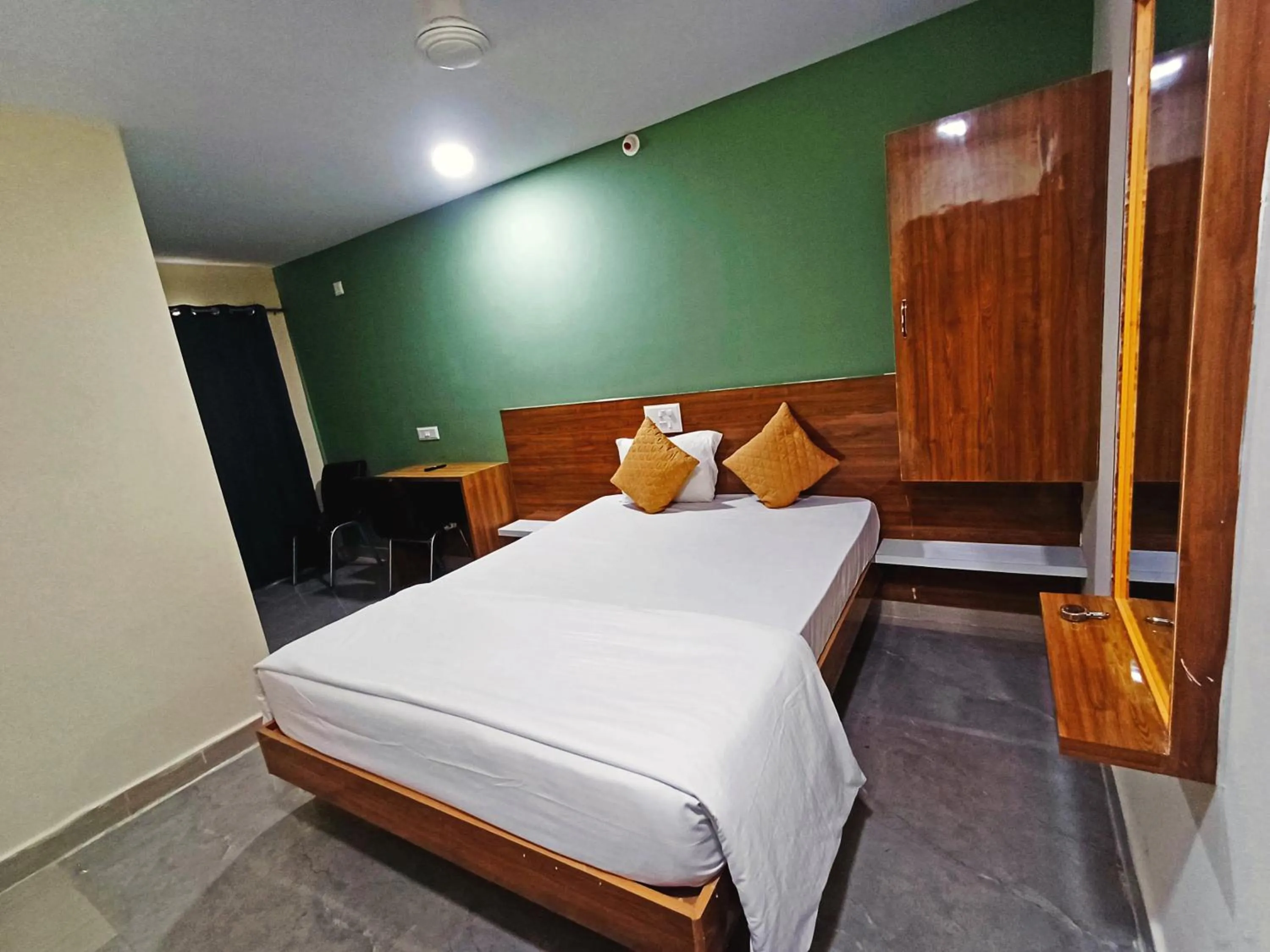 Bedroom in Udupi Deluxe Lodge Gulbarga