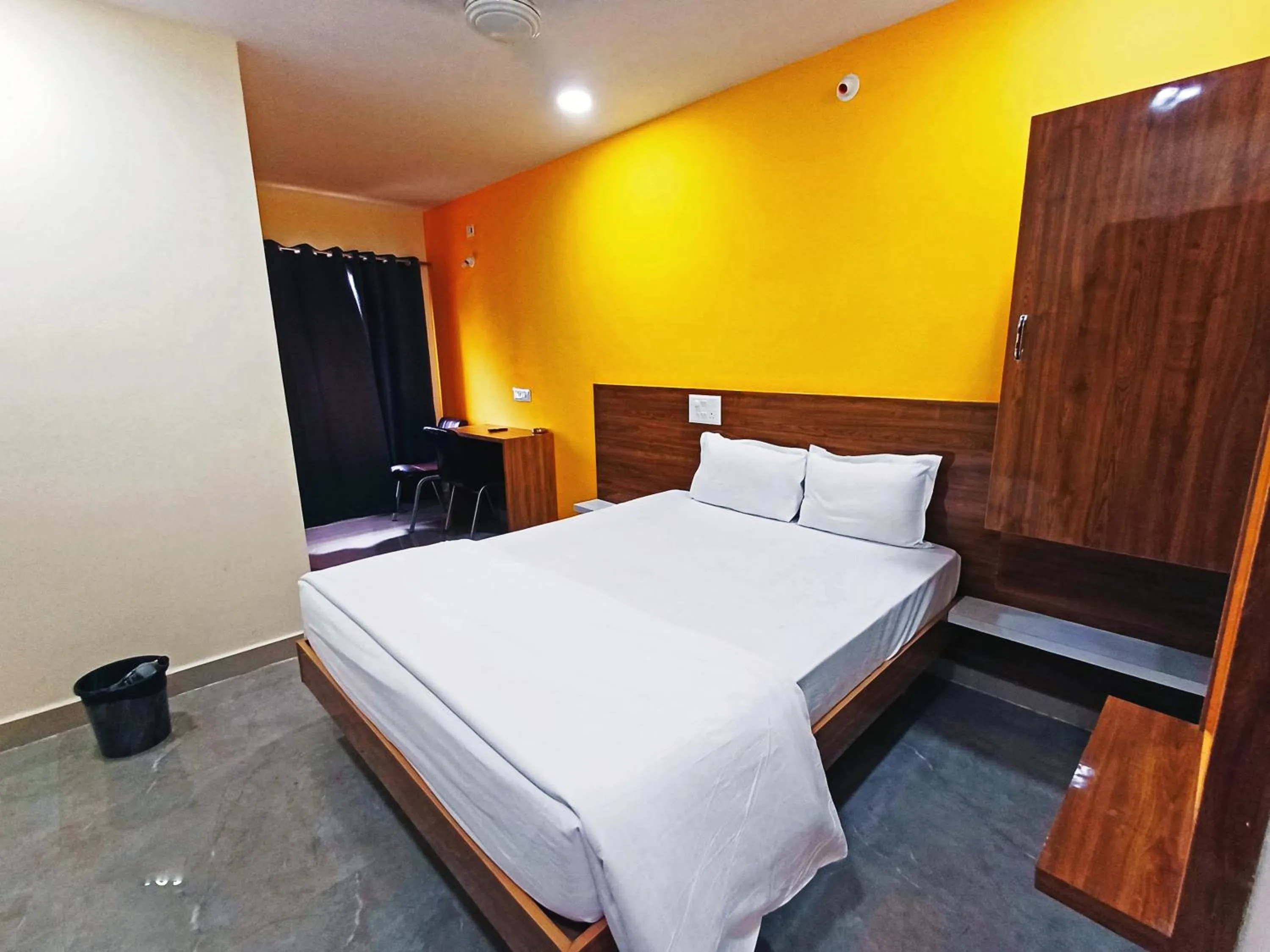 Bedroom in Udupi Deluxe Lodge Gulbarga