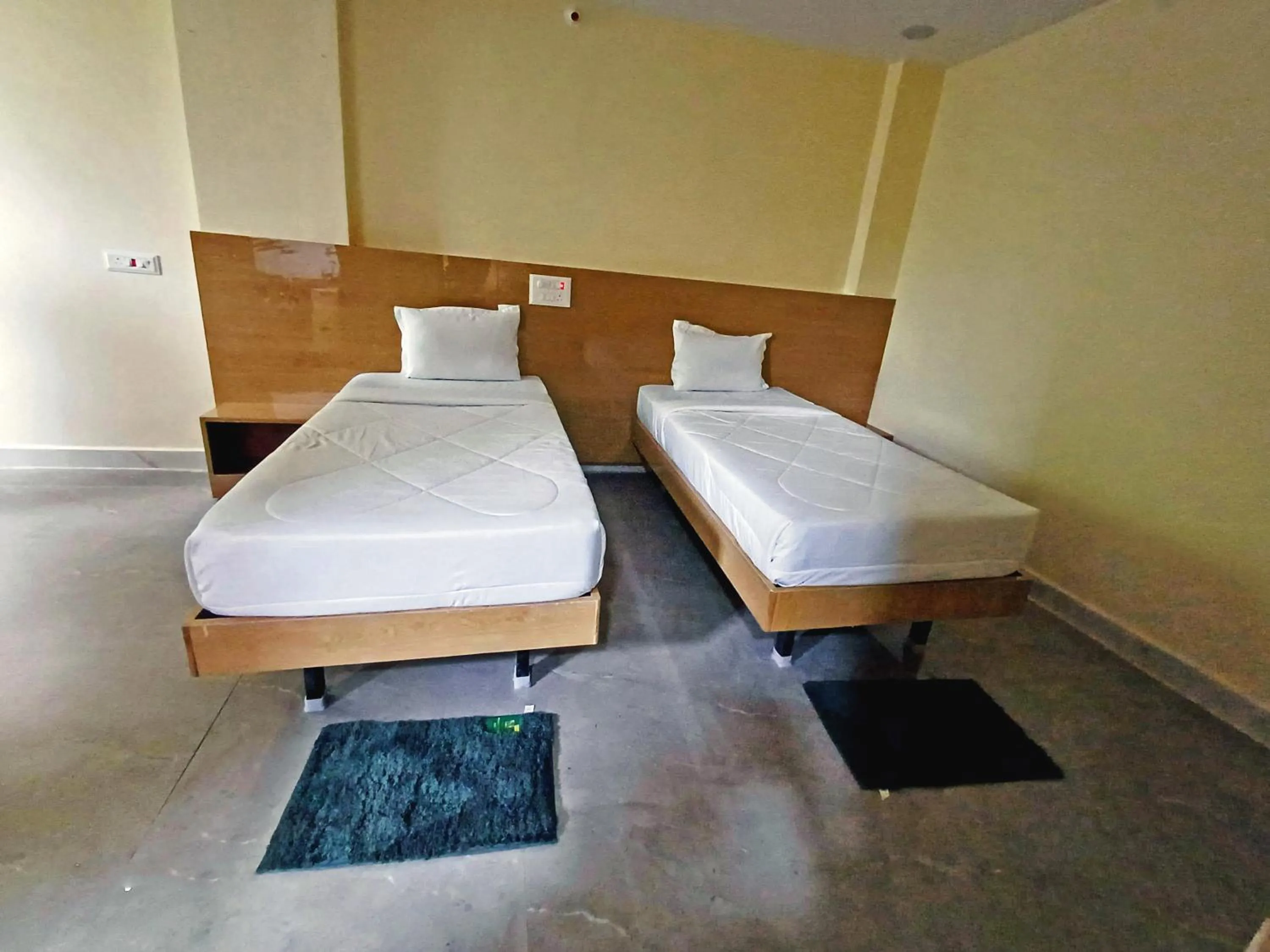 Bedroom in Udupi Deluxe Lodge Gulbarga