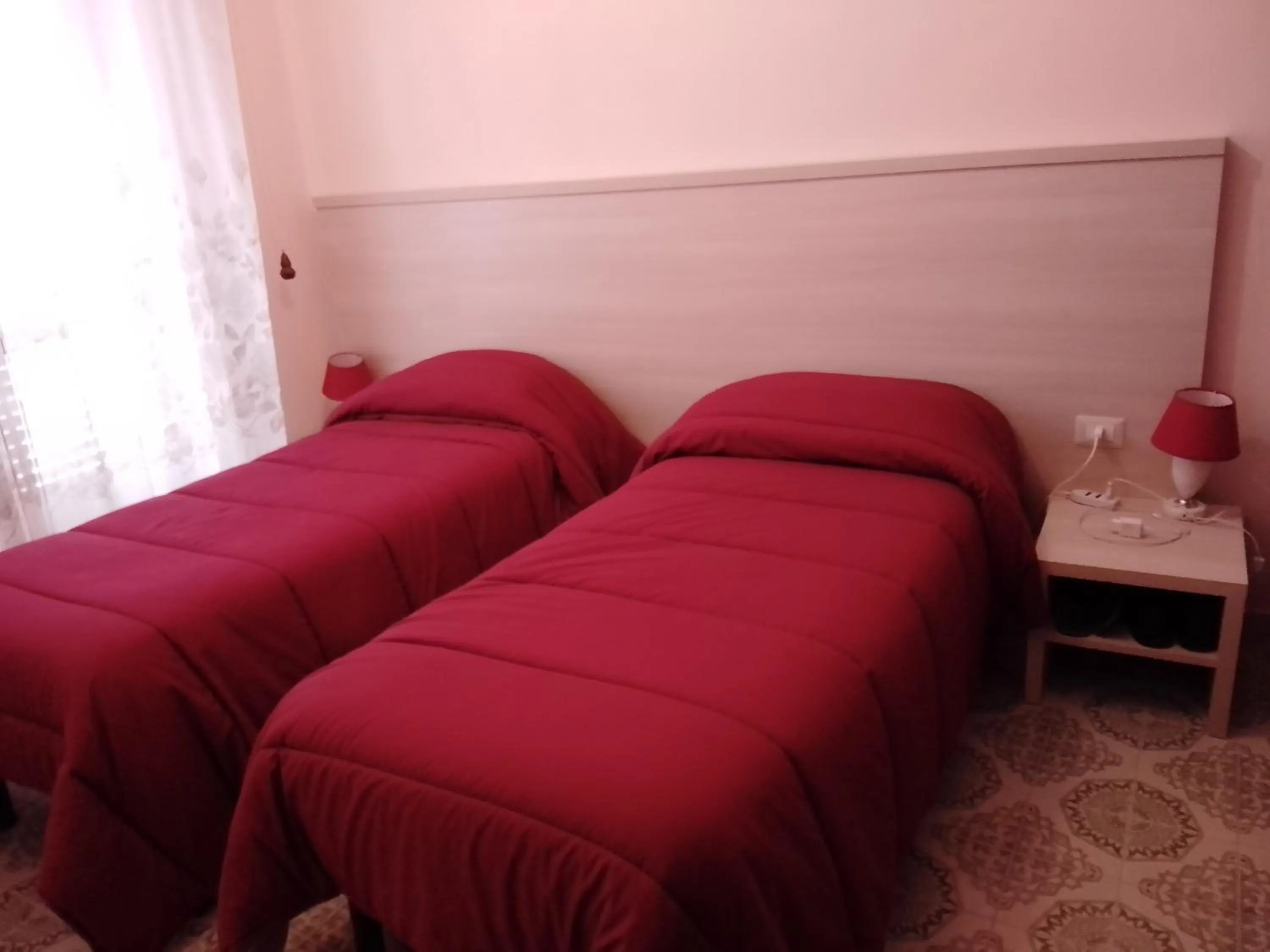 Bed in Albergo Maria Cristina