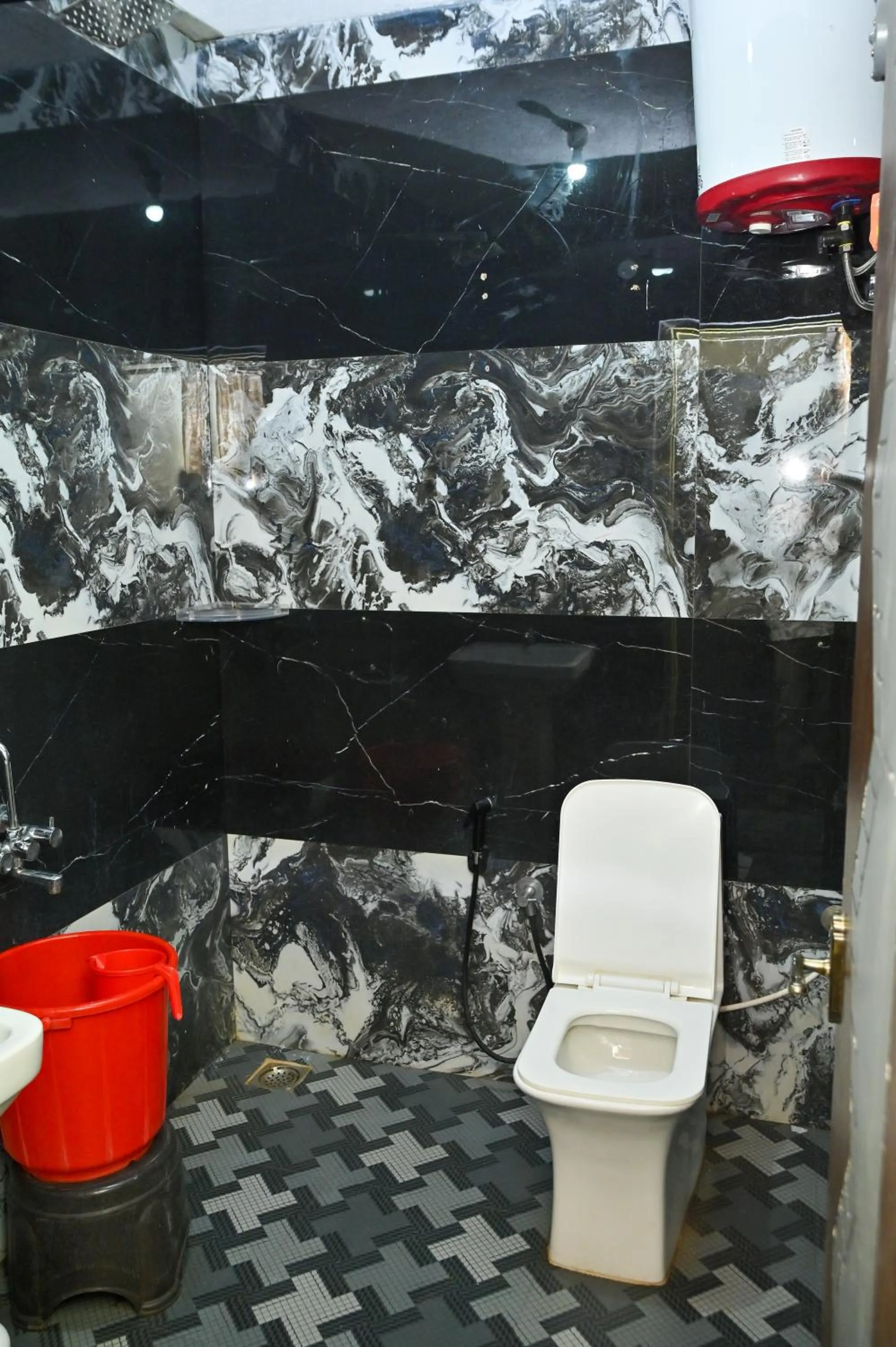 Toilet in NAVARATHNA International resort