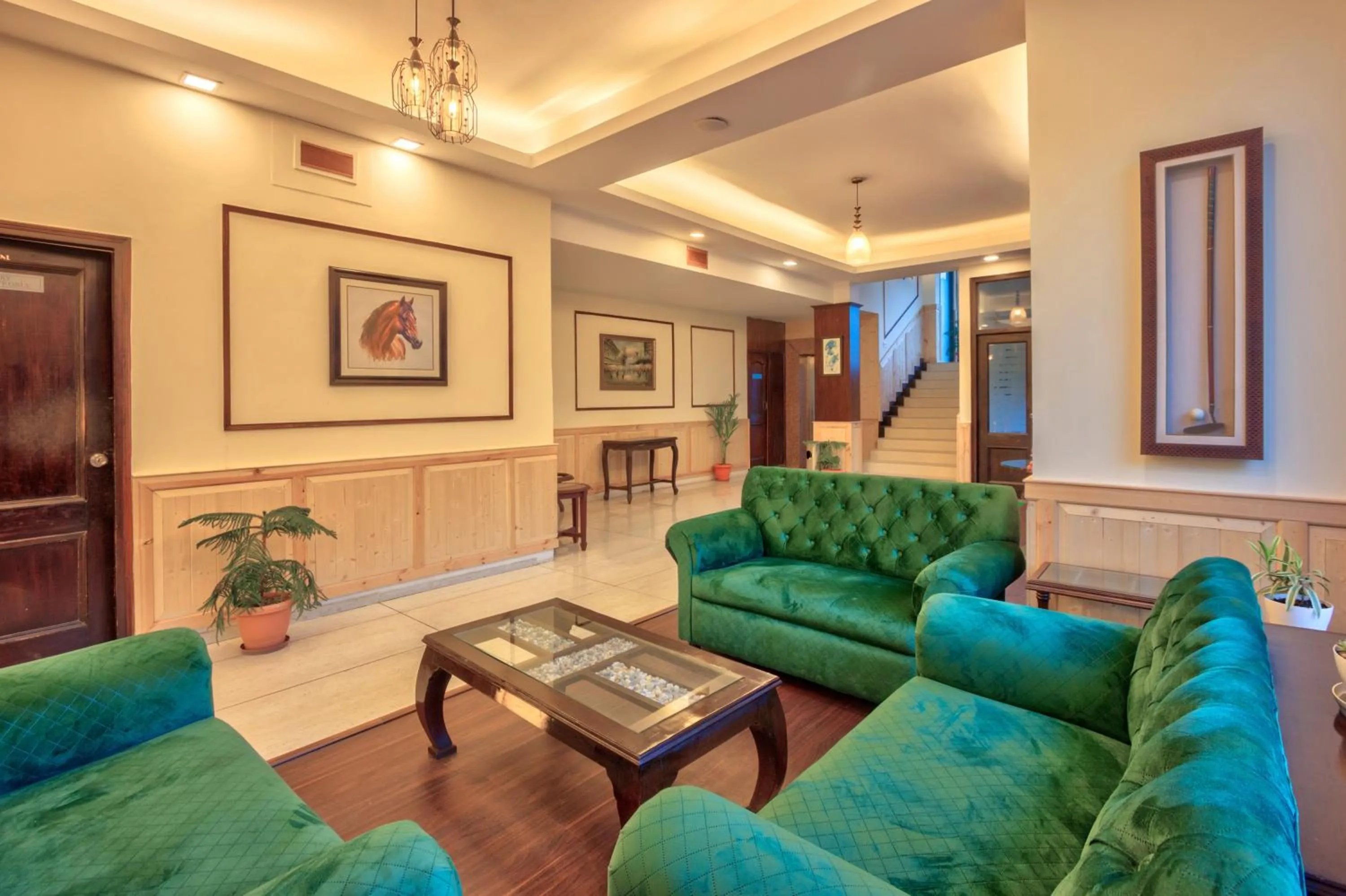 Communal lounge/ TV room in The Katoch Grand Resort